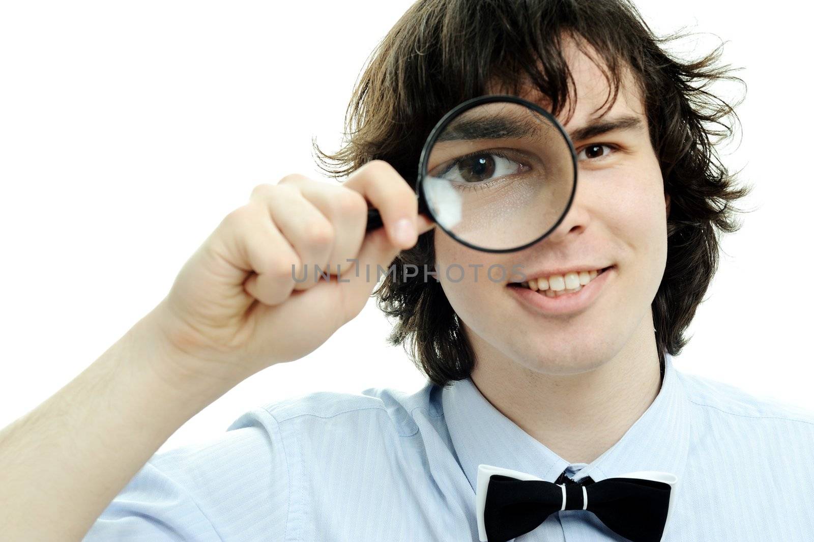 An image of a young man with a magnifier