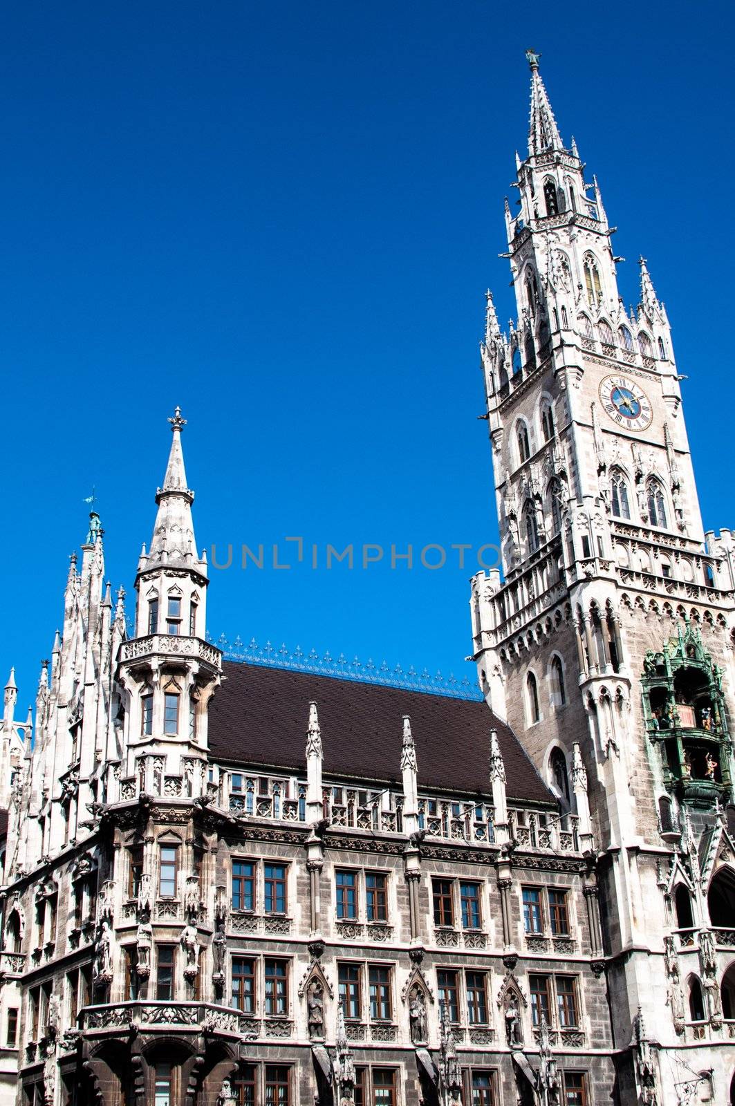 Munich City Hall ;Marienplatz (Town Hall) with its mechanical clock, or Glockenspiel, in Munich, Germany.