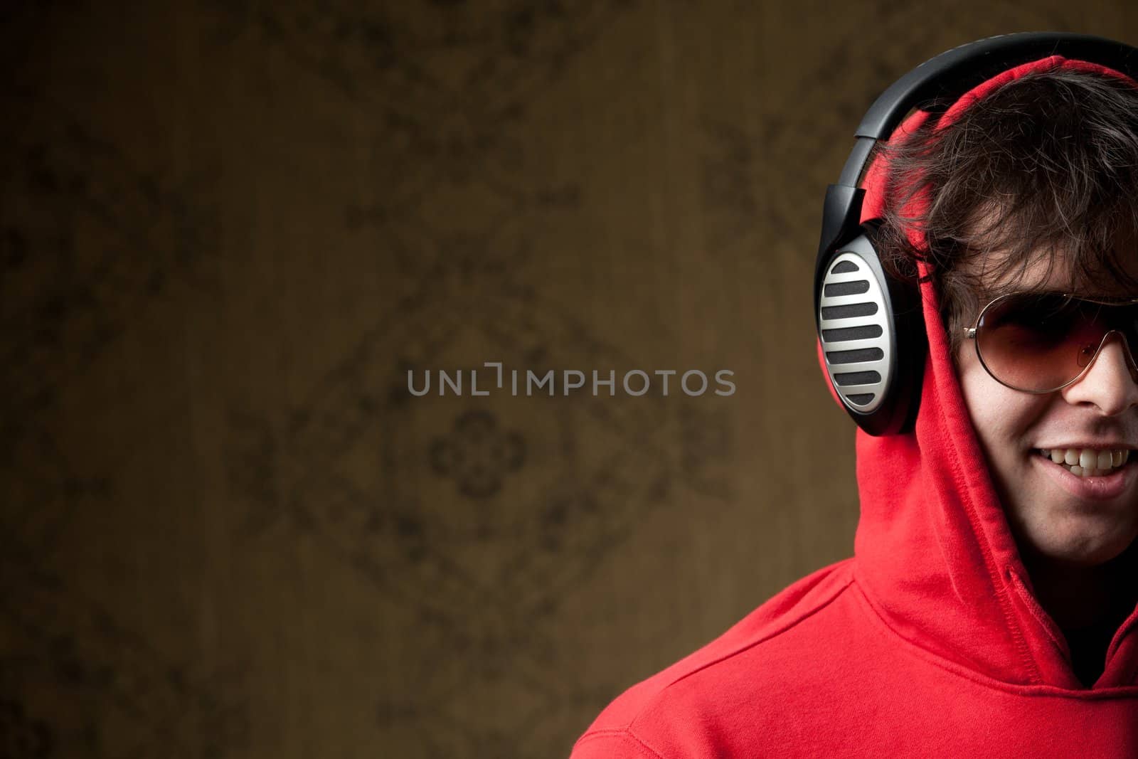 An image of a young boy listening to music in headphones