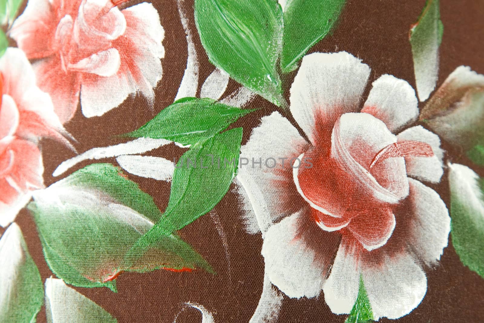 flower and green leaf print on brown fabric