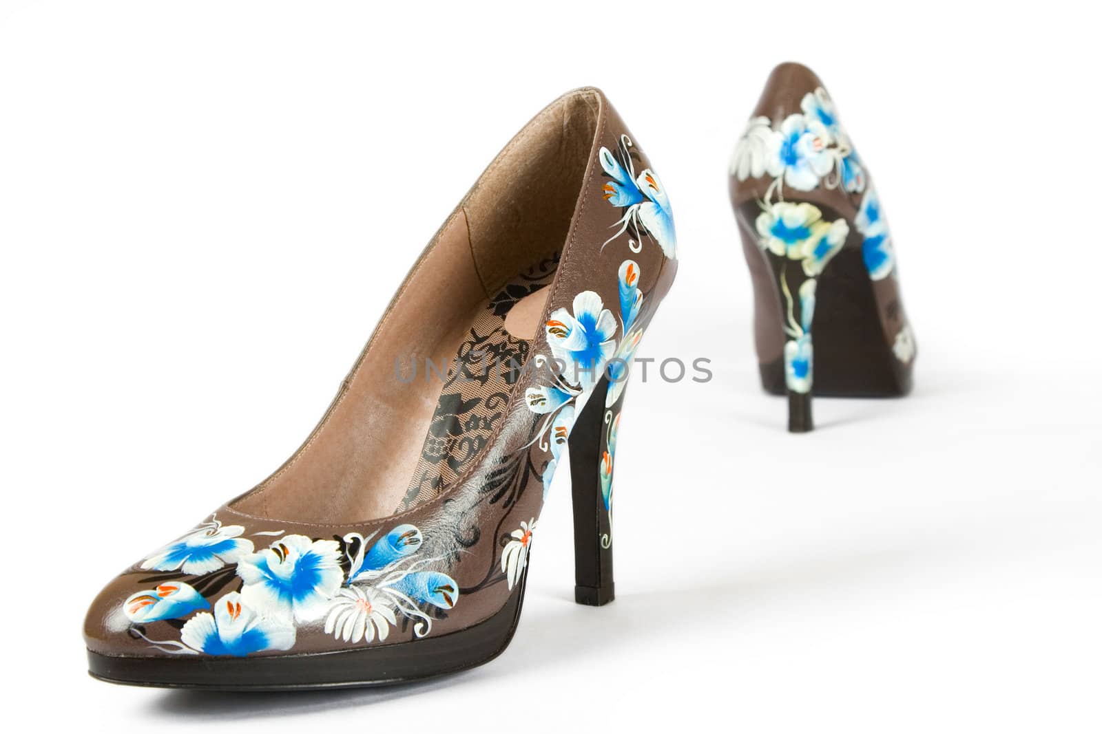 brown women high heels shoes with printed flower on white background