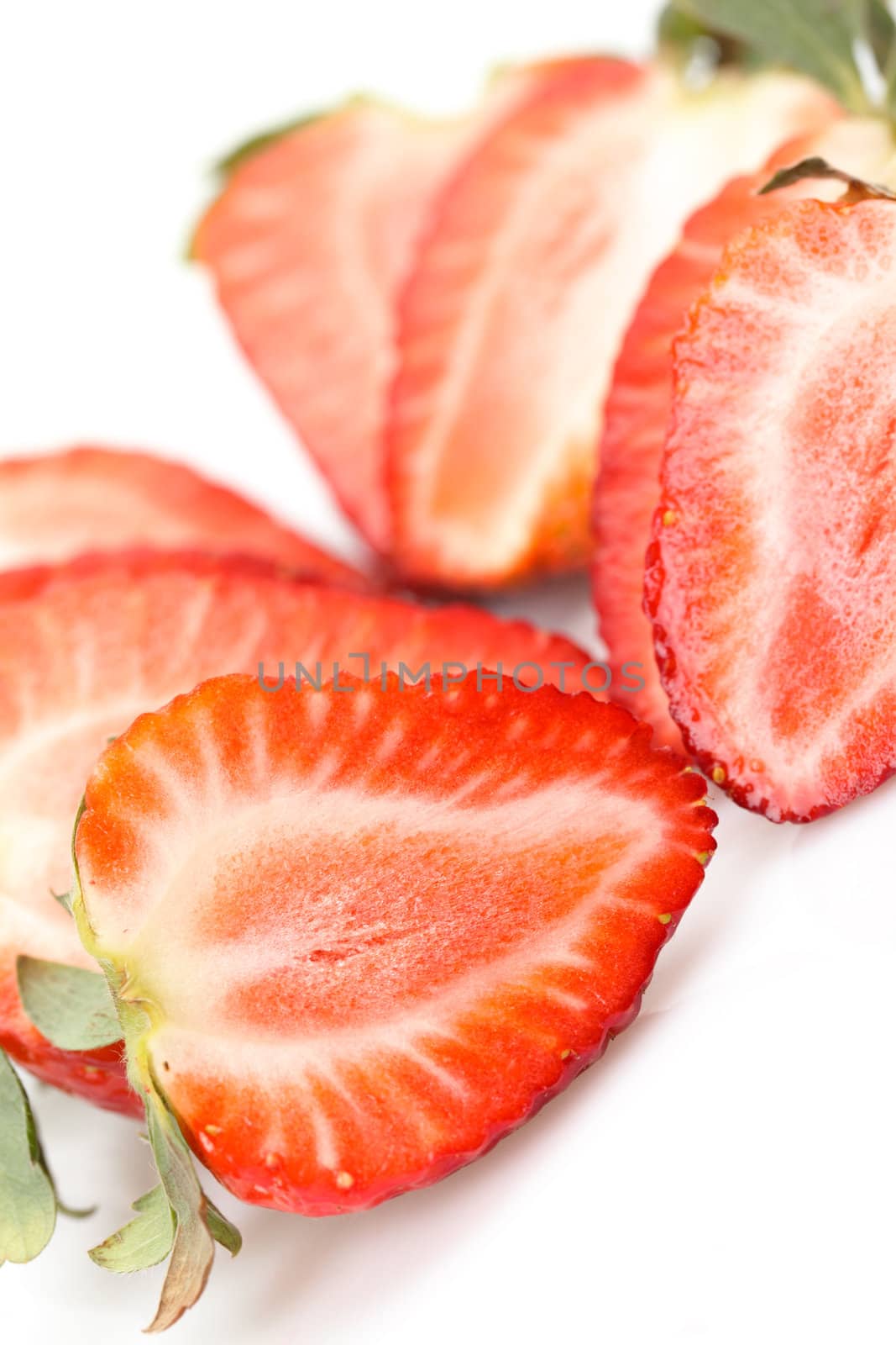 Fresh Strawberries closeup over white background