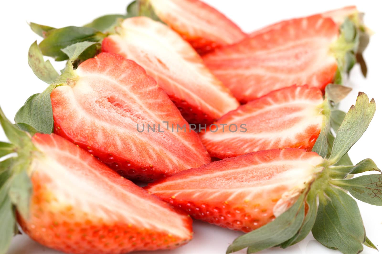 Fresh Strawberries closeup over white background