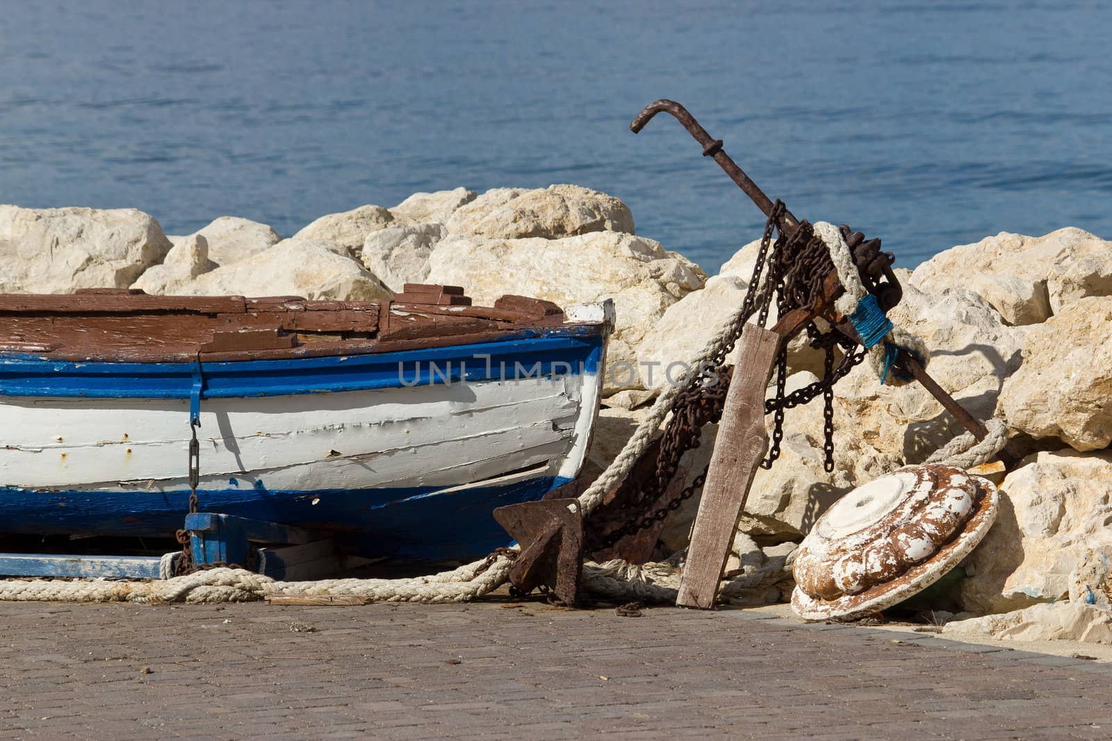 Old wooden boat and rusty anchor by xbrchx