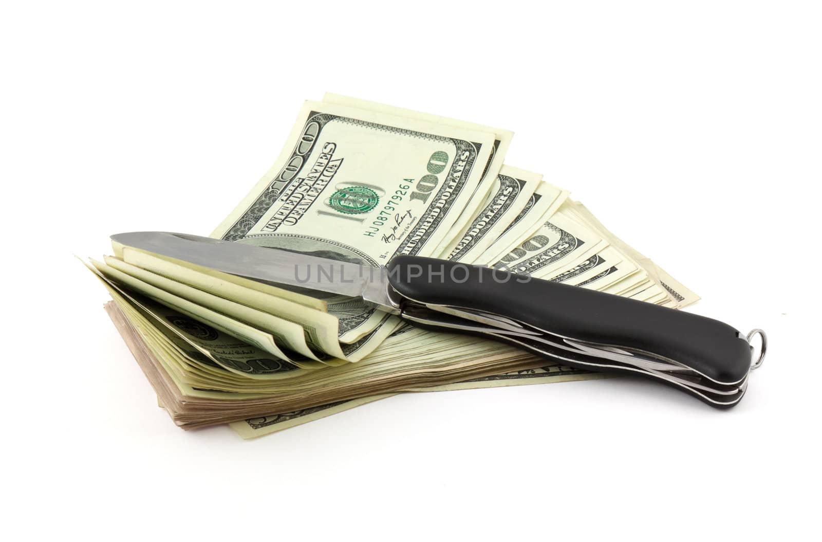 Dollars and knife isolated on white