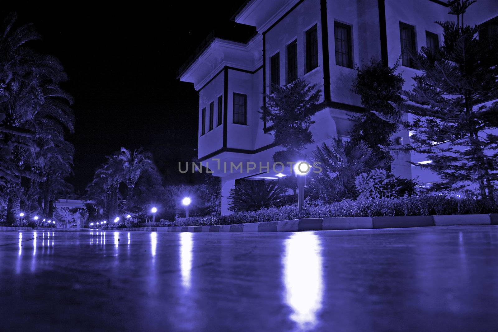mansion with external illumination in warm summer night