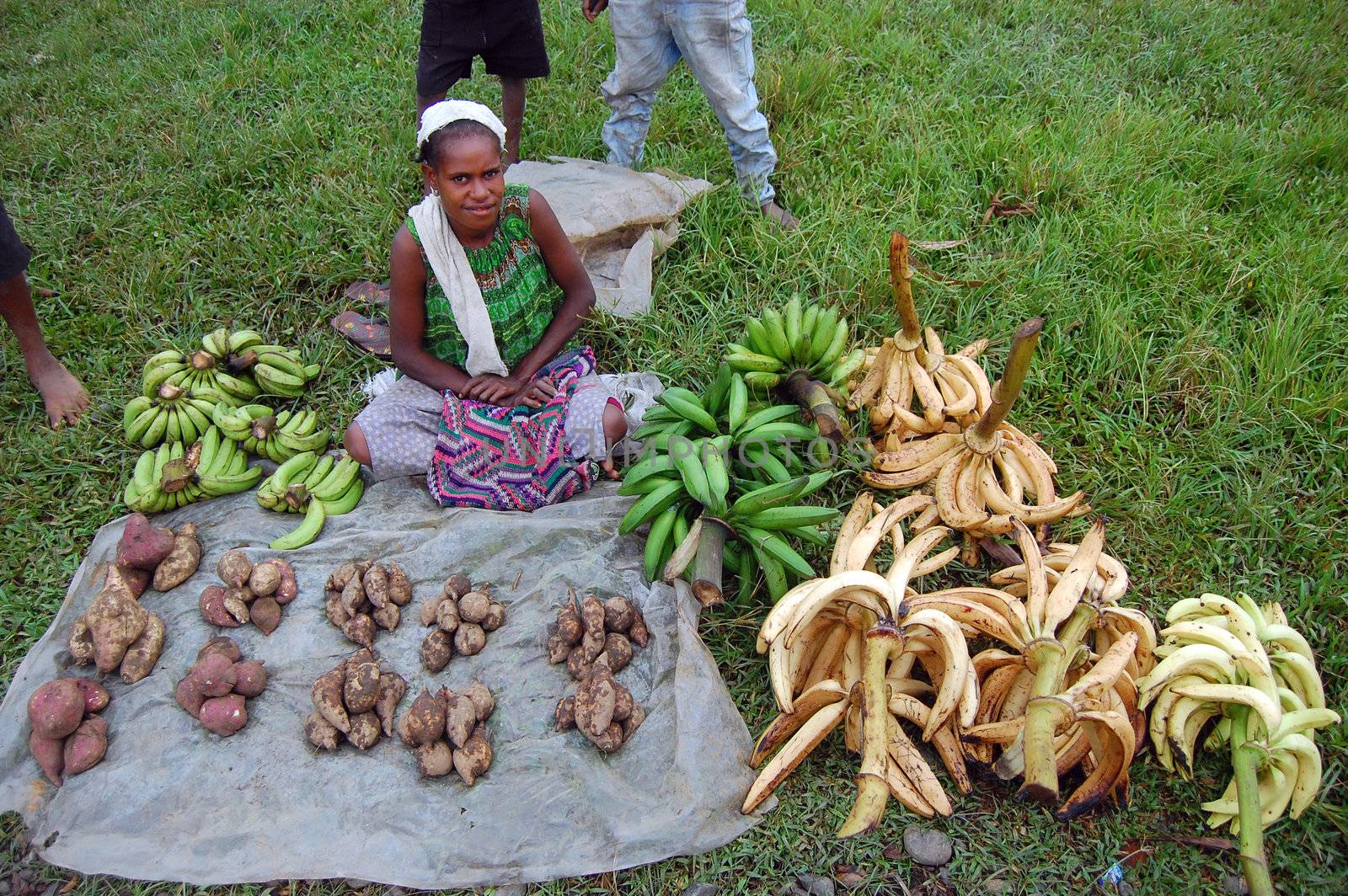 Woman sales bananas on market, village in Papua New Guinea