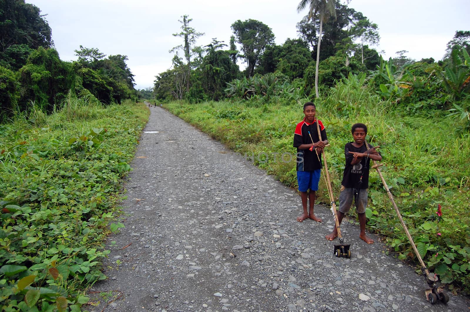 Two boys standing on the road in Papua New Guinea