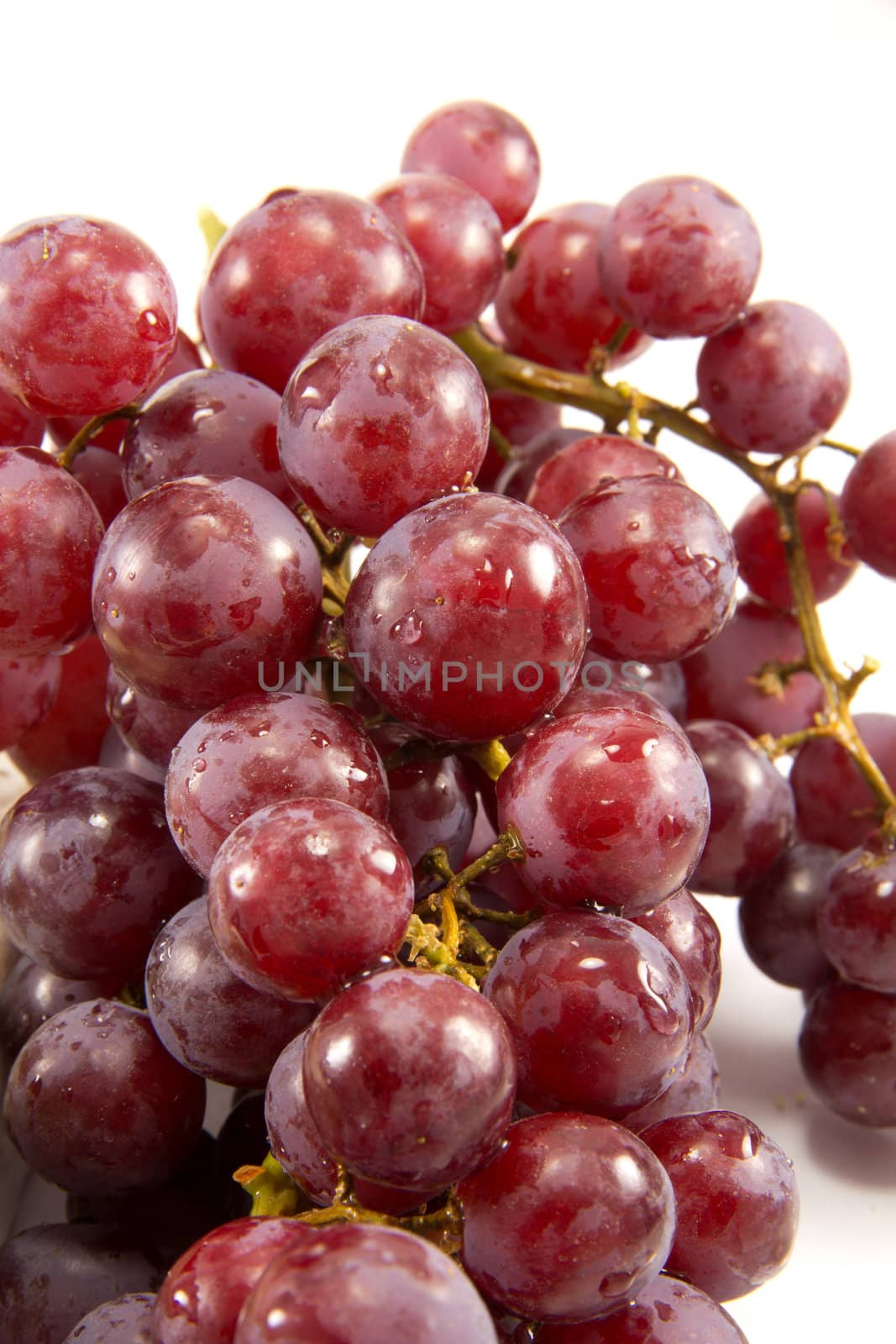 Picture of a bunch of red grapes on a white background