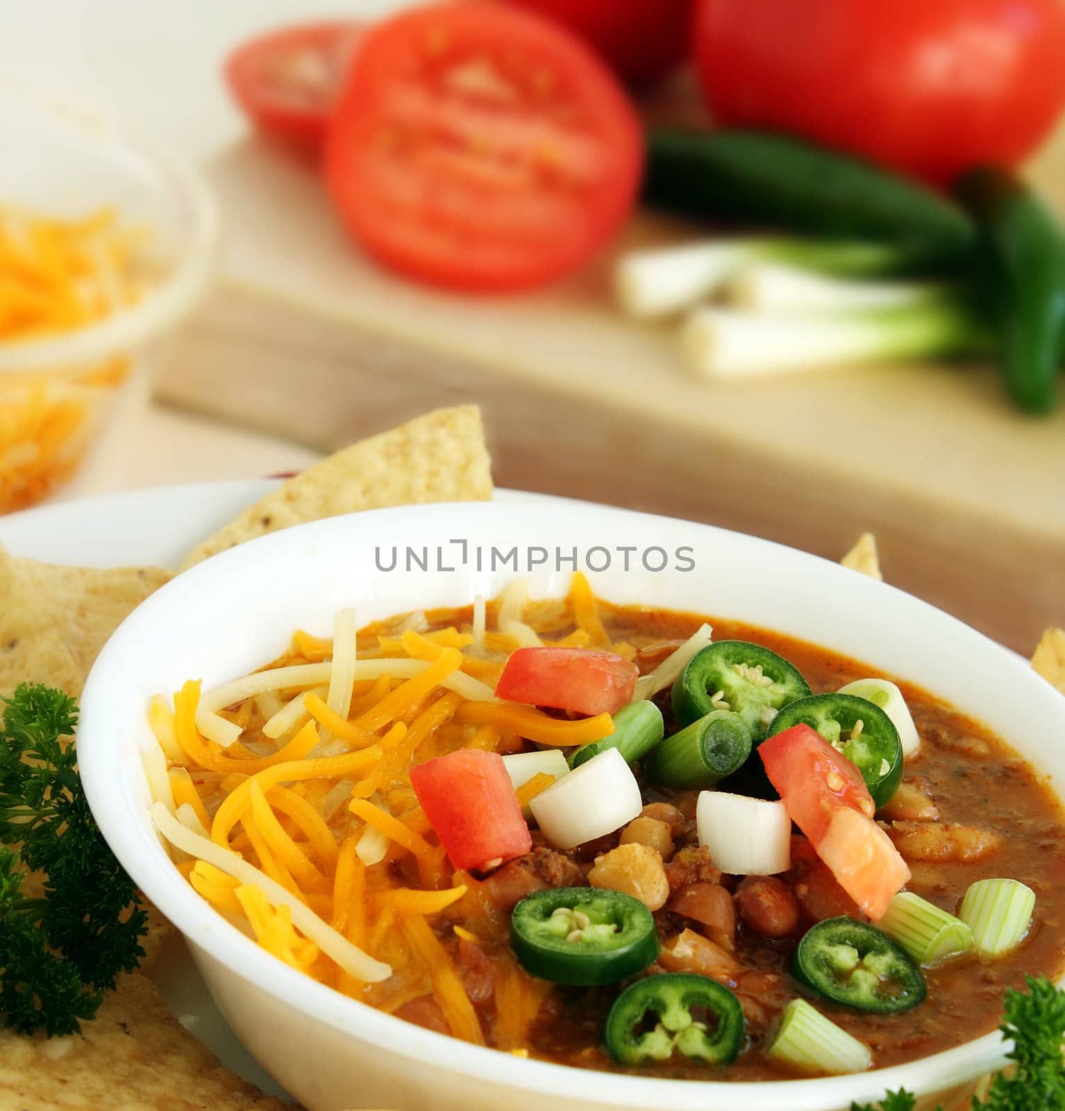 Southwest mexican style bean soup with green onions, tomatoes, jalapenos and cheese