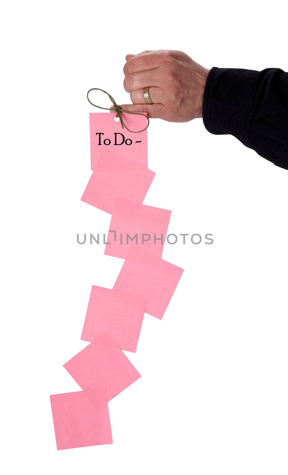 Household organization takes careful planning to be successful with a string of sticky notes on a white background