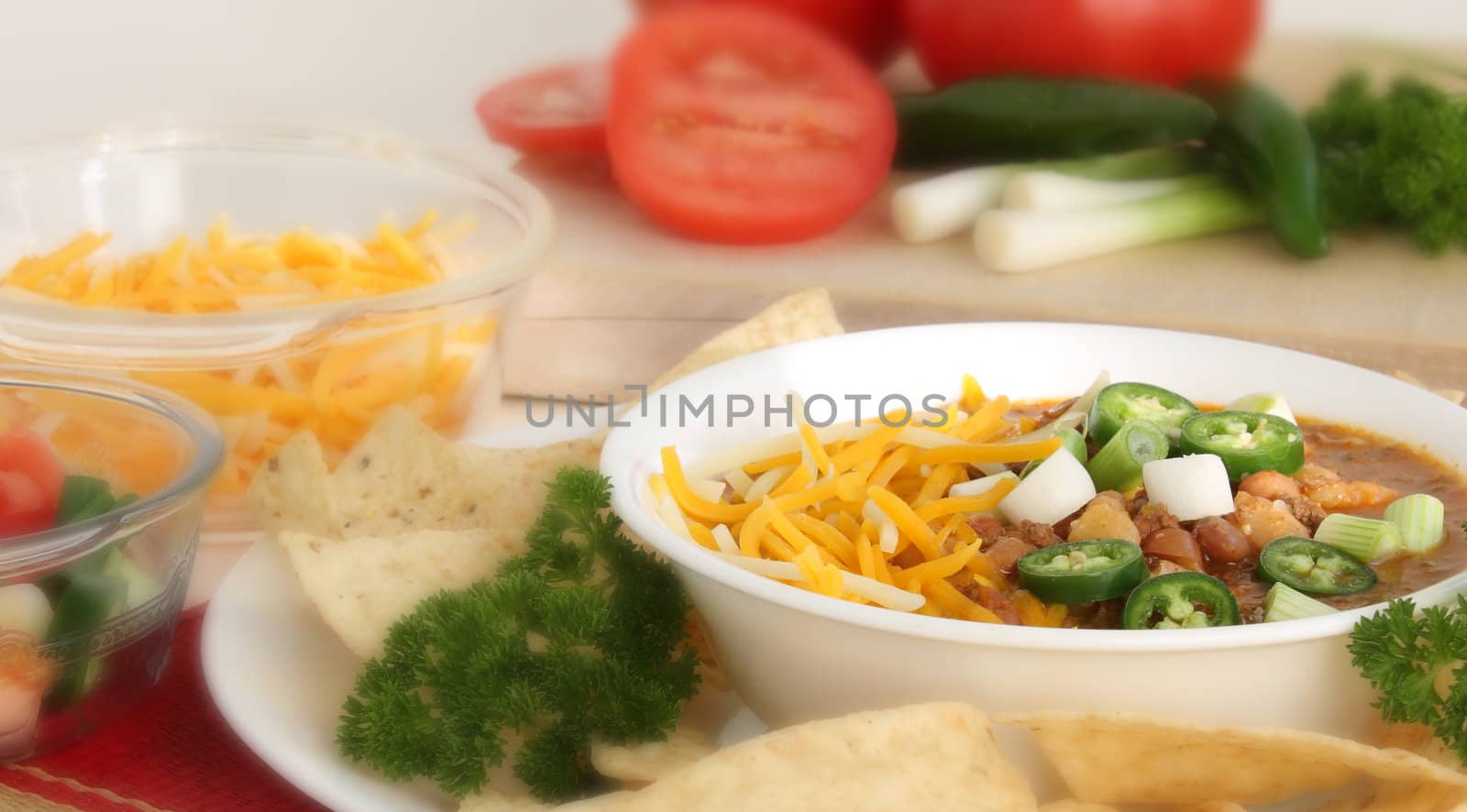 Southwest mexican style bean soup with green onions, tomatoes, jalapenos and cheese