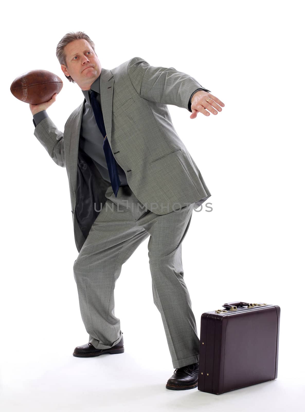 Business Man Throws a Football by libyphoto