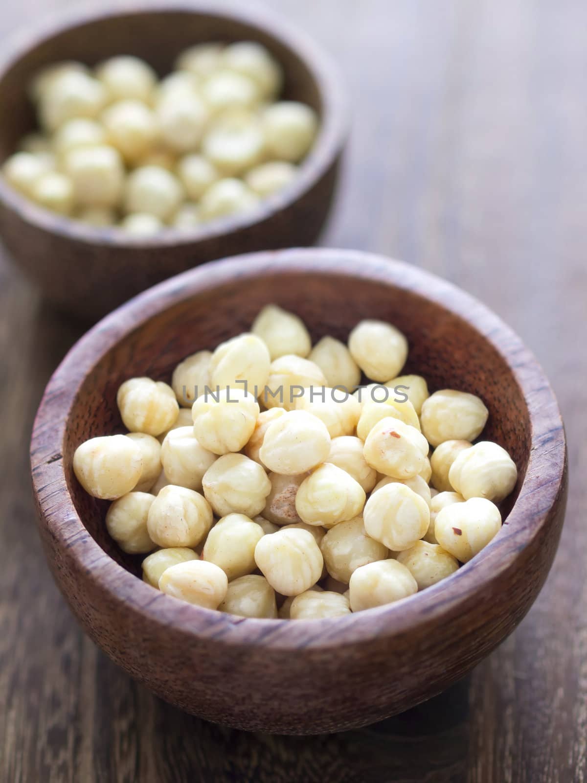 close up of bowls of hazelnuts