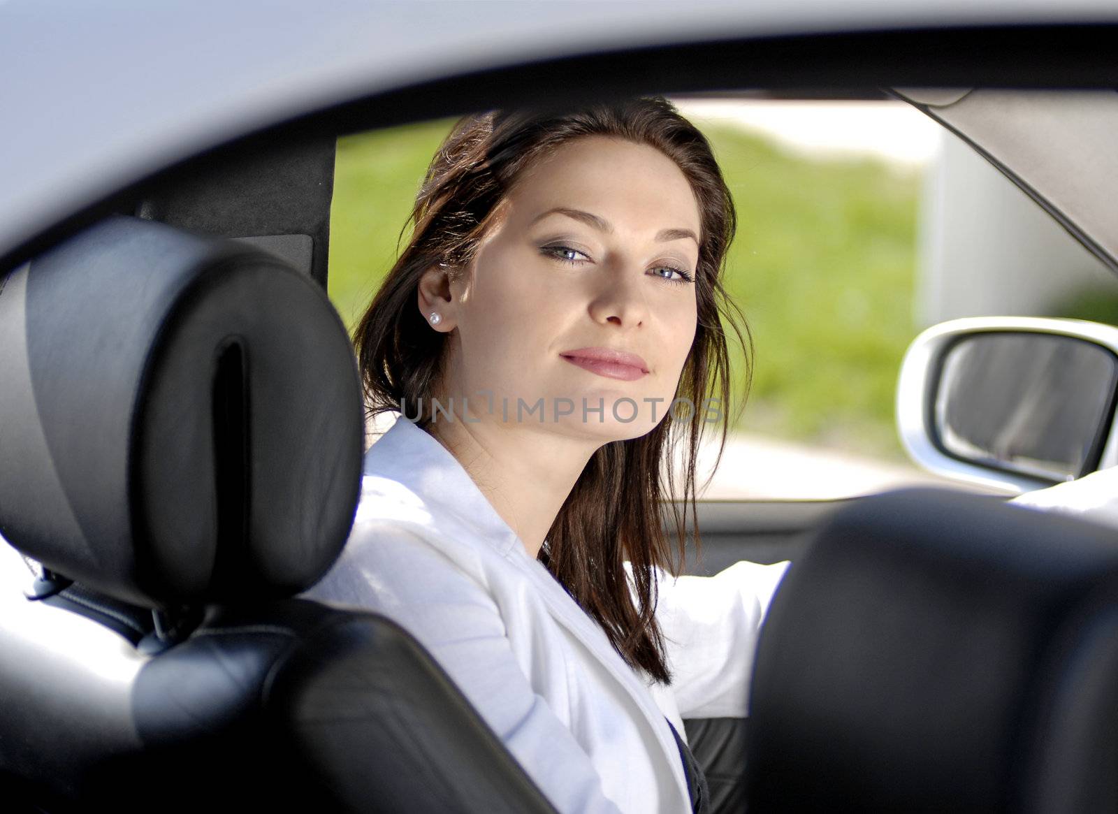 beautiful businesswoman siting in the premium car