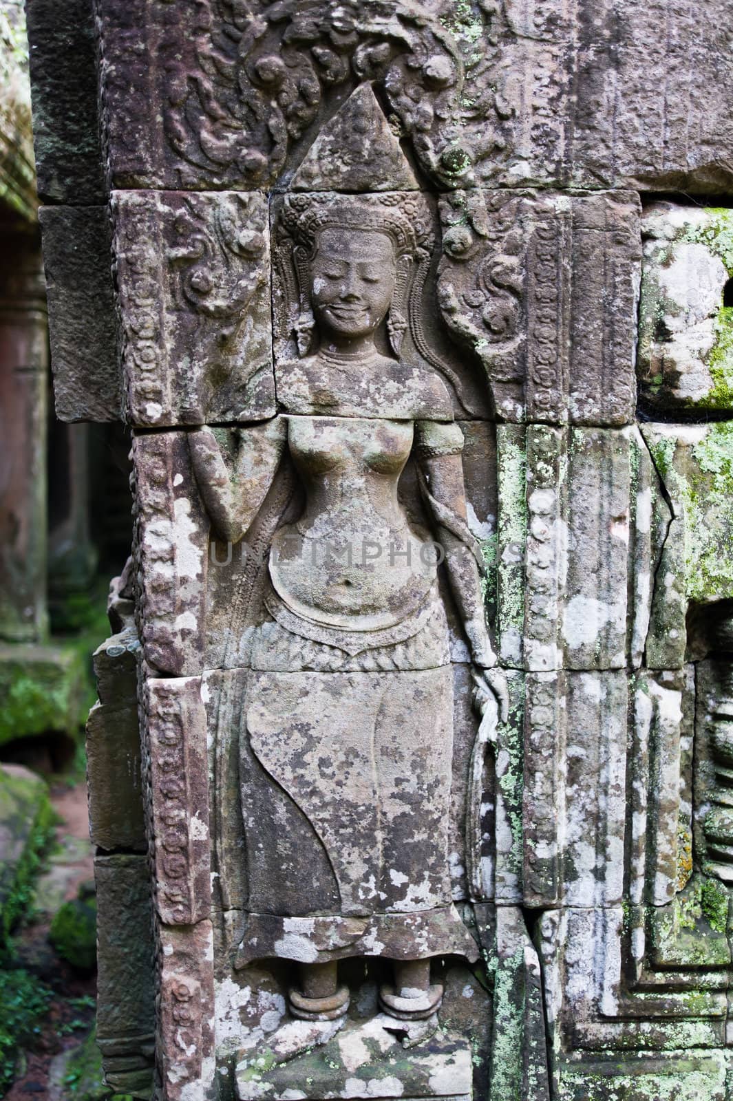 Apsara carved on the wall of Bayon Temple by photoroman