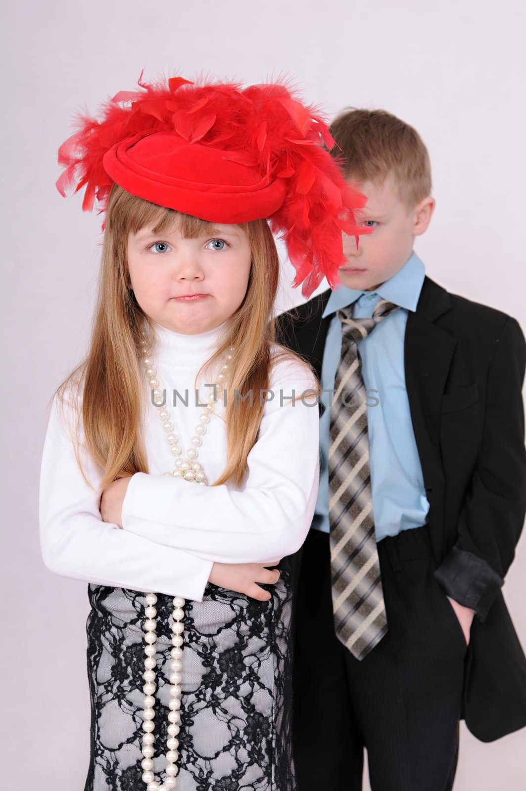 sad girl in a red hat waiting for an apology from the boy