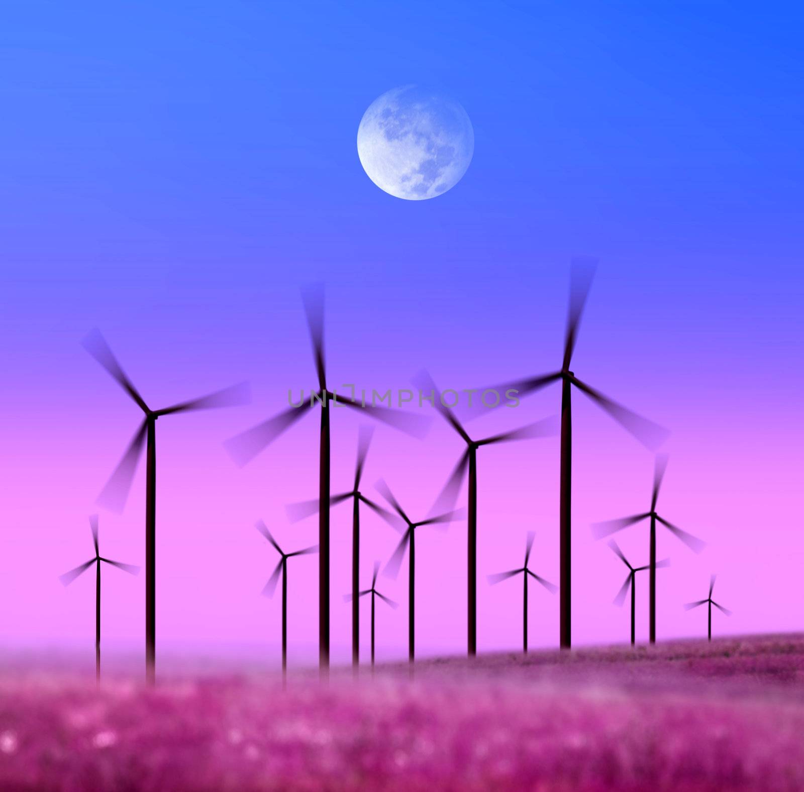 silhouette of wind turbines generating electricity on night sky