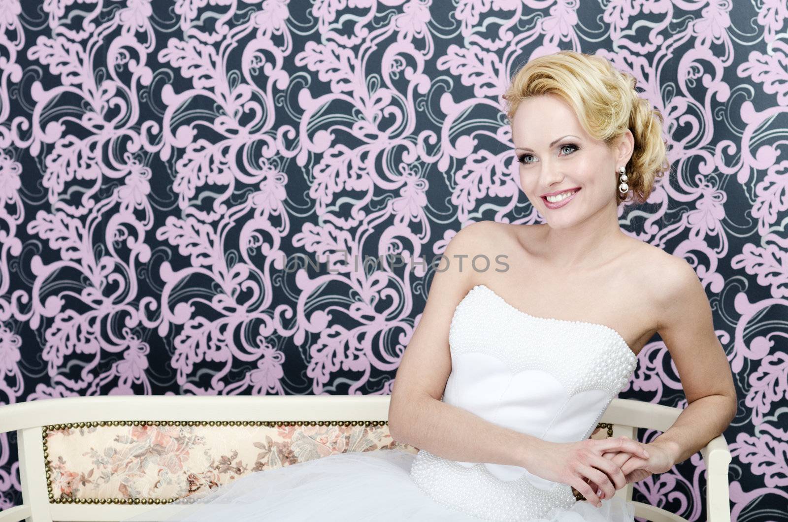Bride smiling sitting bench by zakaz