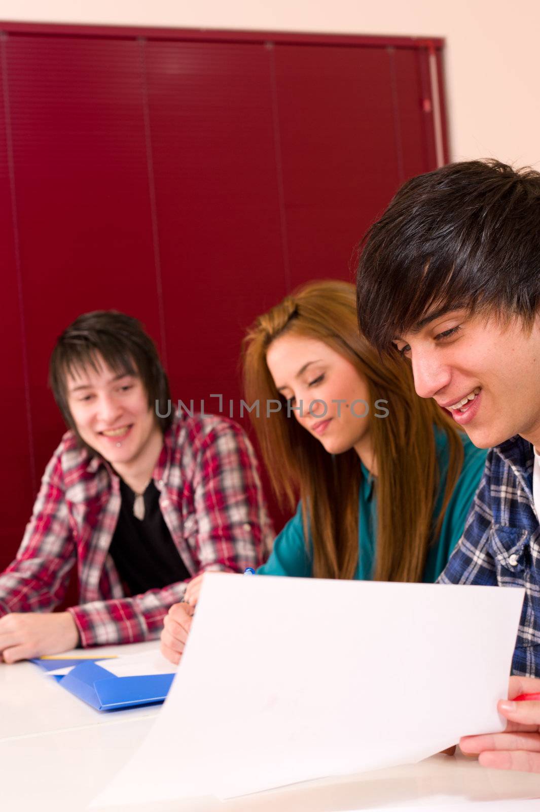 Students inside the classroom at work