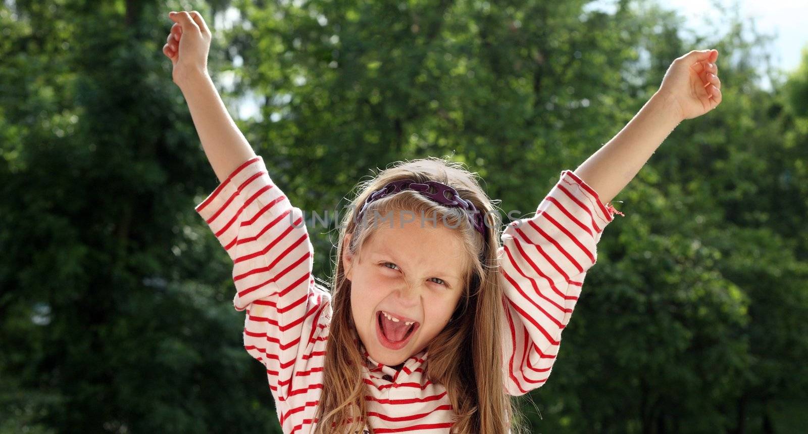 An image of a nice joyful girl outdoors