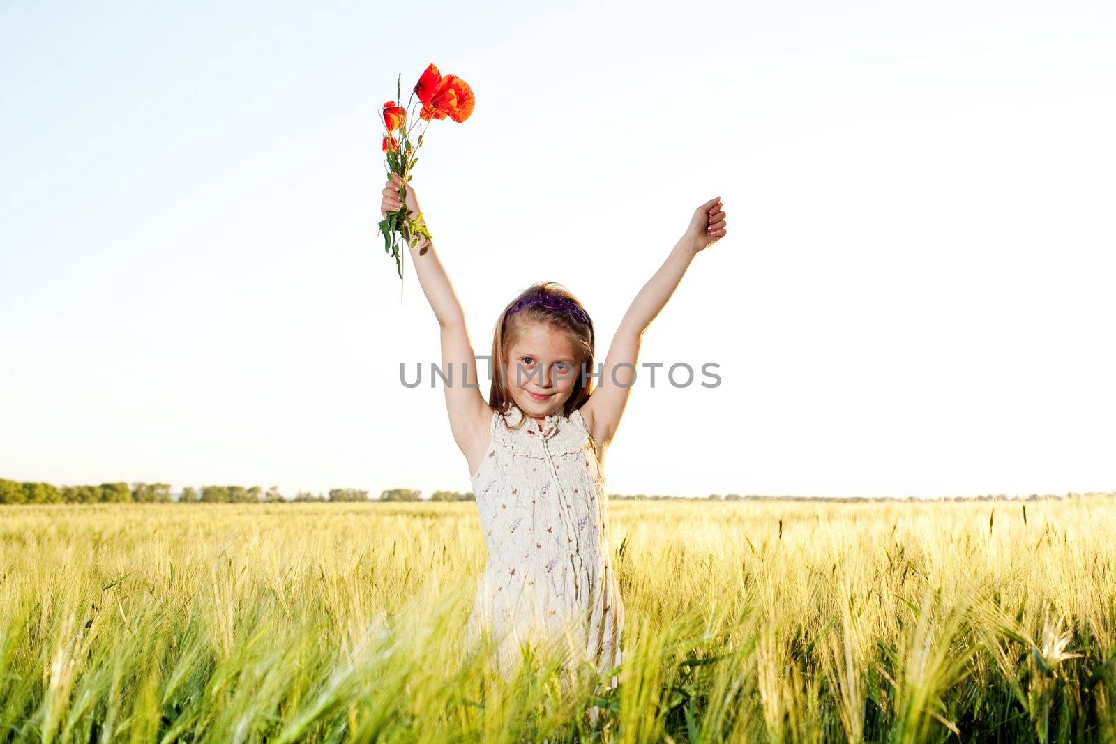 An image of a nice little girl in the field