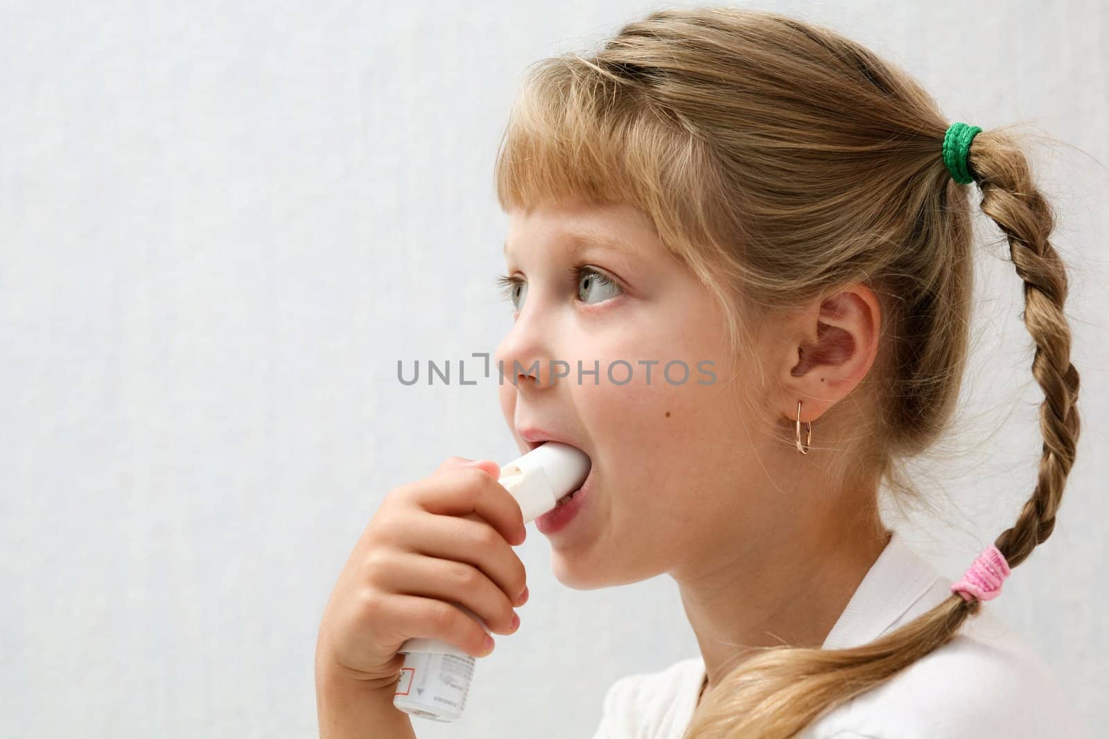 An image of a girl making inhalation