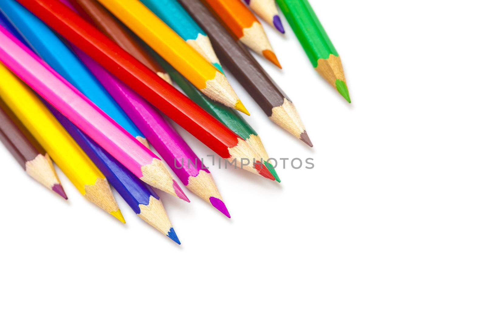 a group of colored pencils