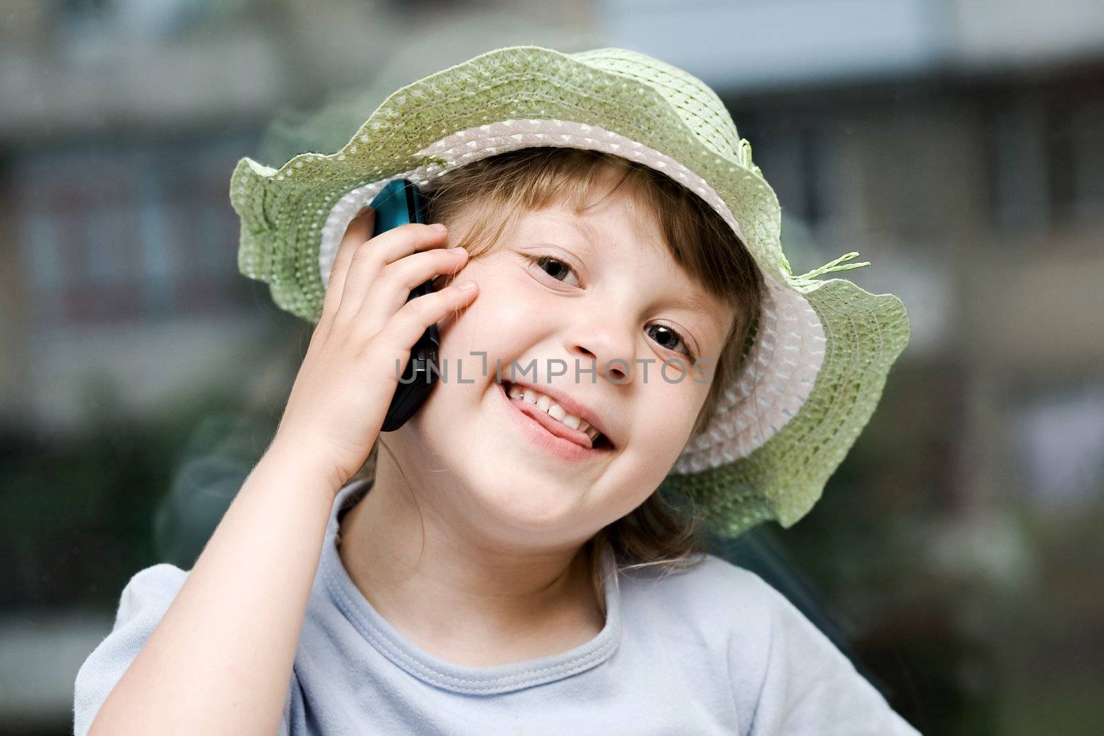 An image of young girl speaking on the phone