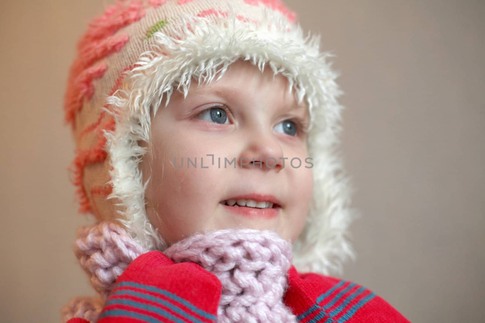 An image of a girl in red mittens