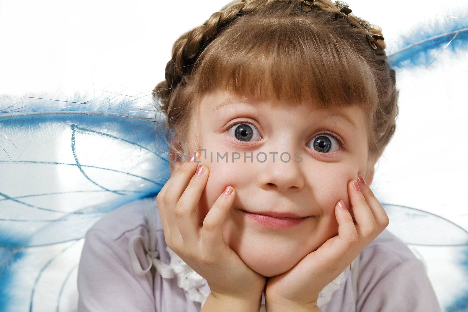 Stock photo: an image of a little girl with wings