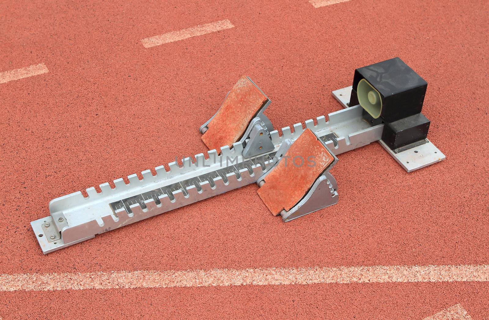 Athletics Starting Blocks on a red running track in a stadion