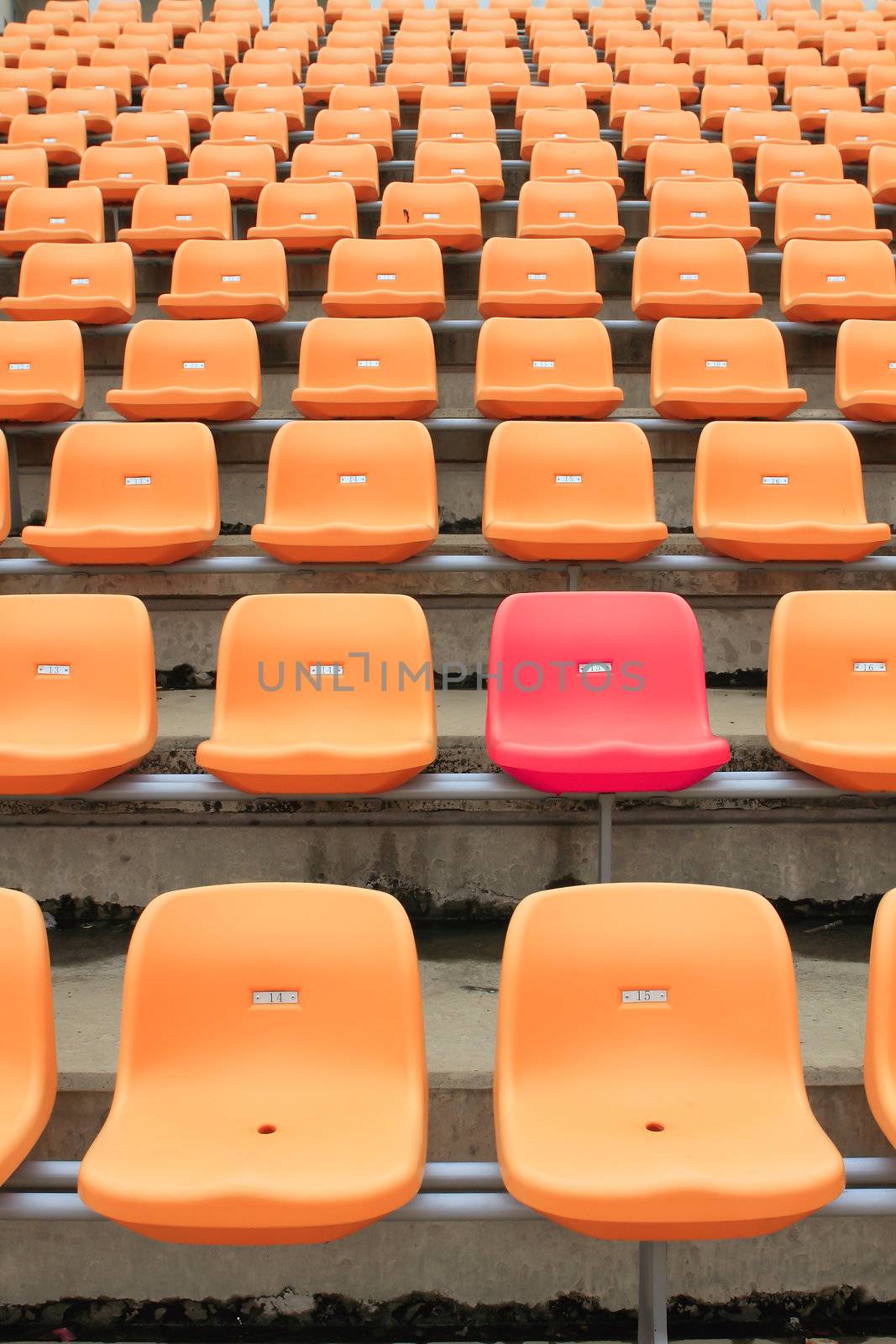 Empty stadium chairs, representing individuality