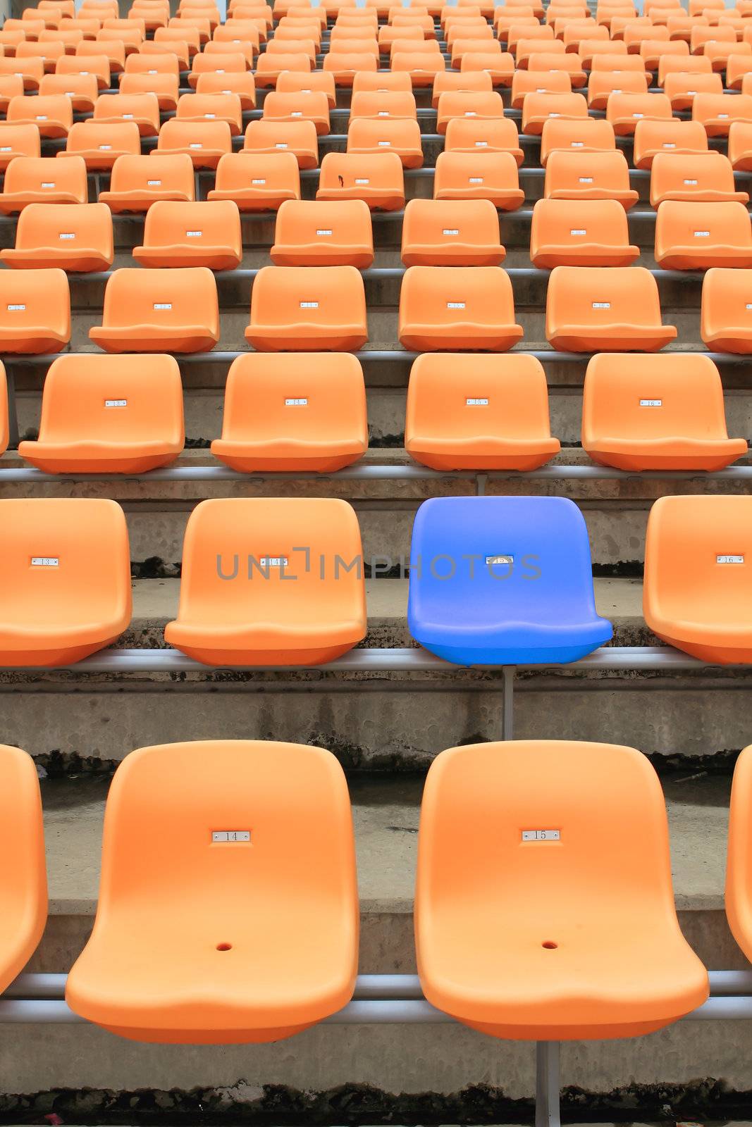 Empty stadium chairs, representing individuality  by rufous