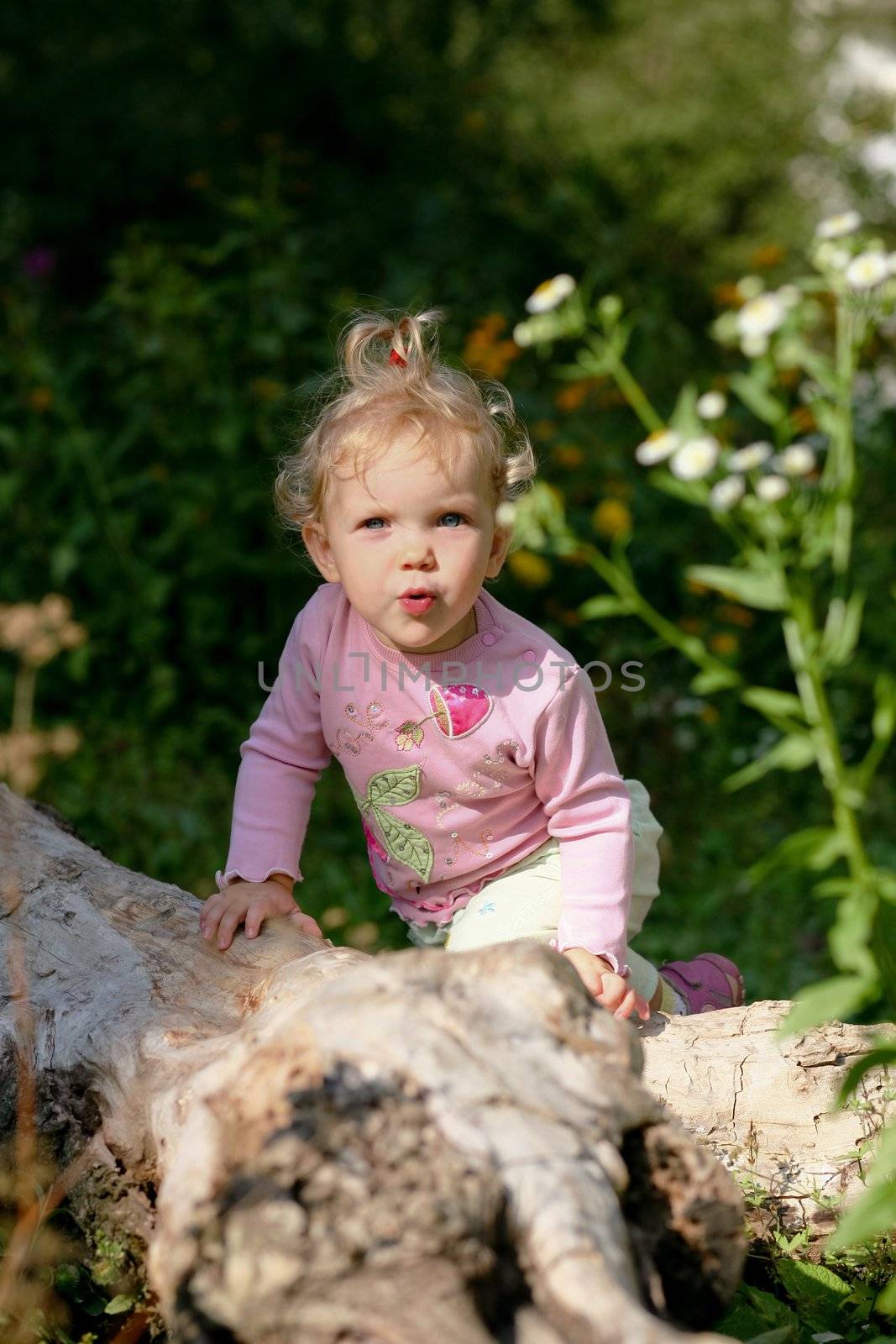 An image of little girl playing outdoor