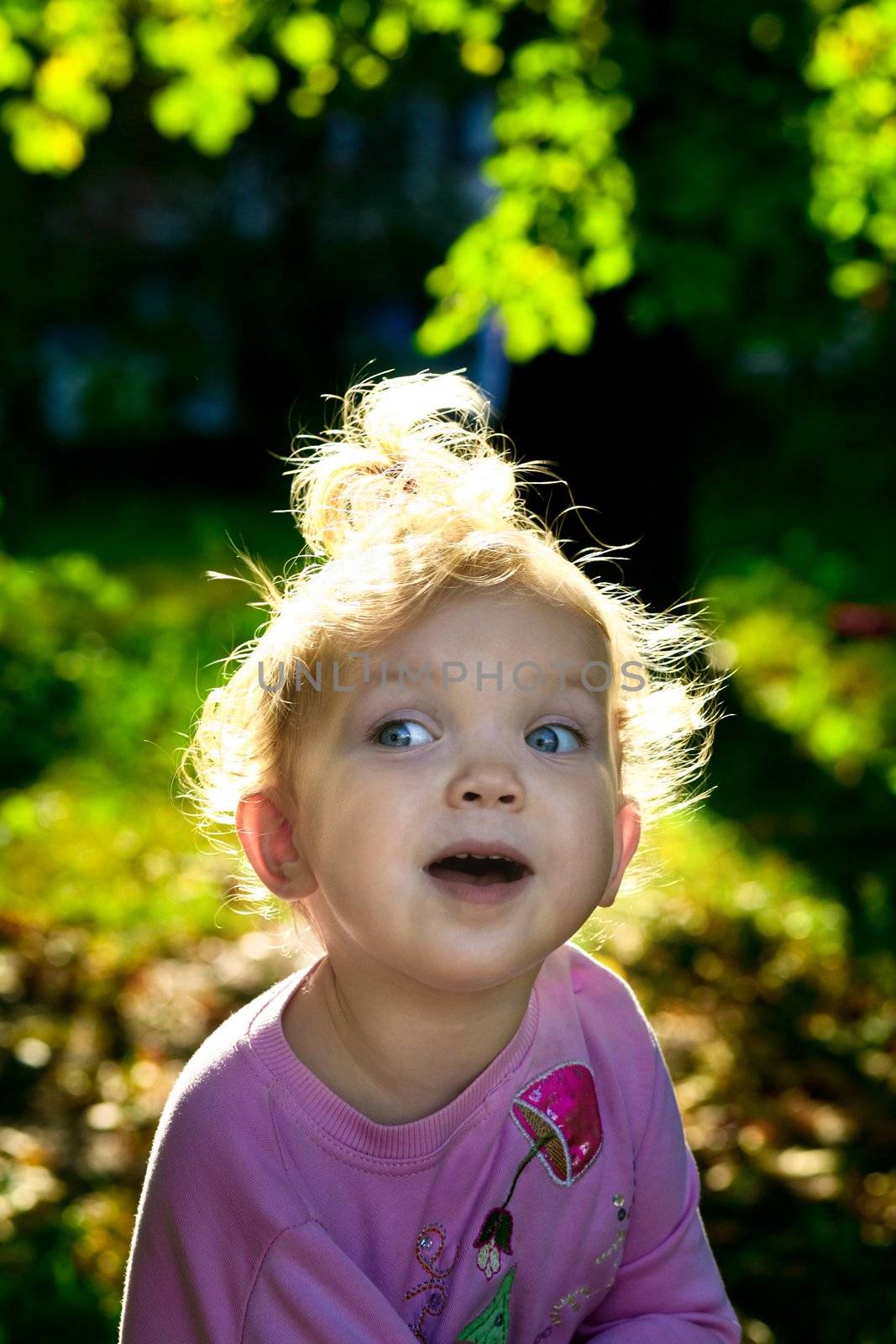 An image of little girl playing outdoor