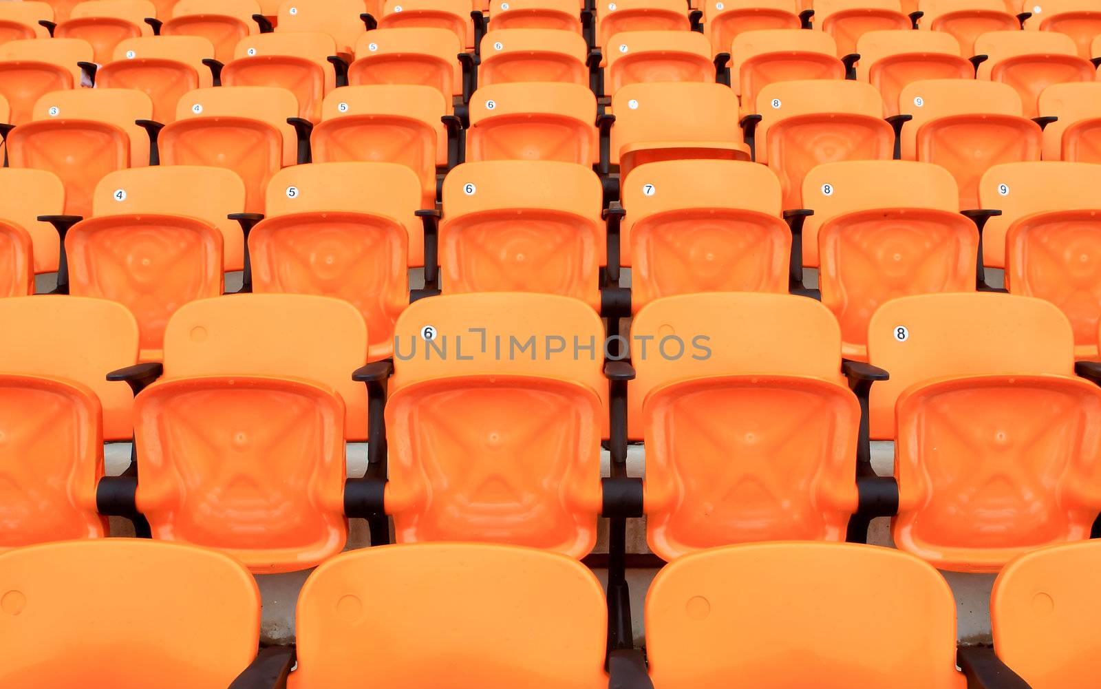Empty stadium chairs, representing individuality by rufous