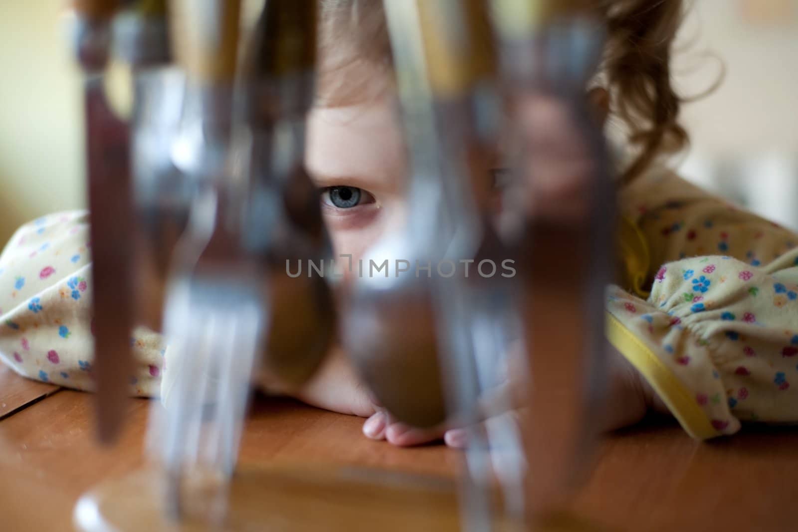 An image of a cute little girl in the kitchen
