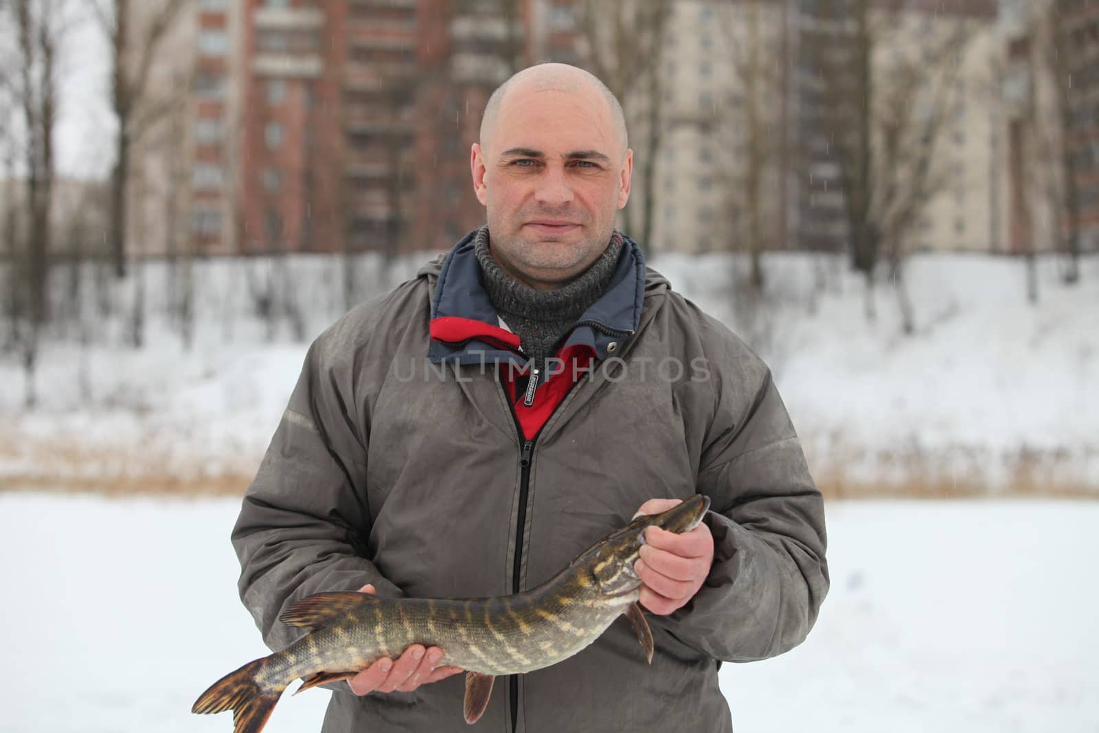 Fisherman caught a pike by mrivserg