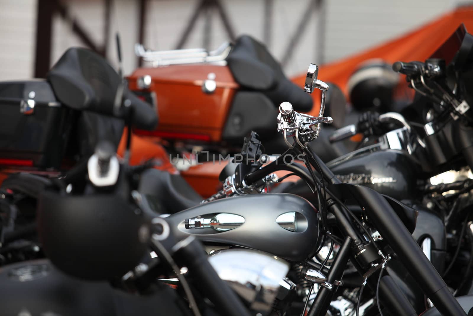 Many modern motorcycles on parking