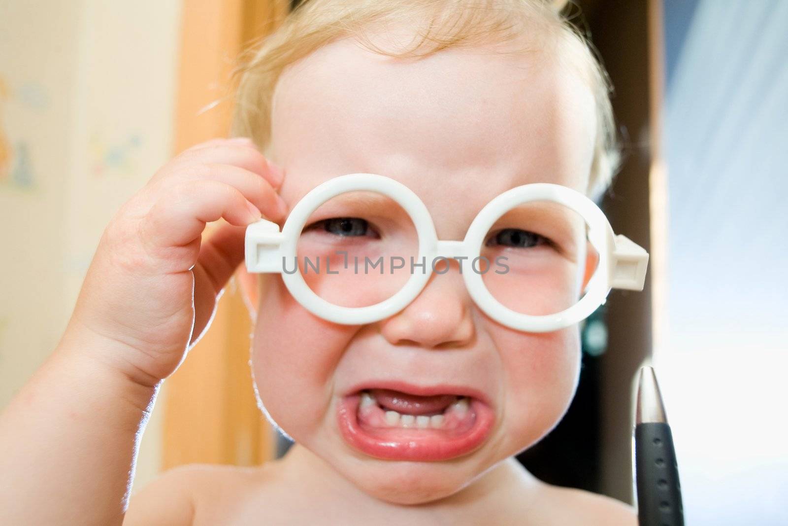 An image of a nice baby in toy-glasses