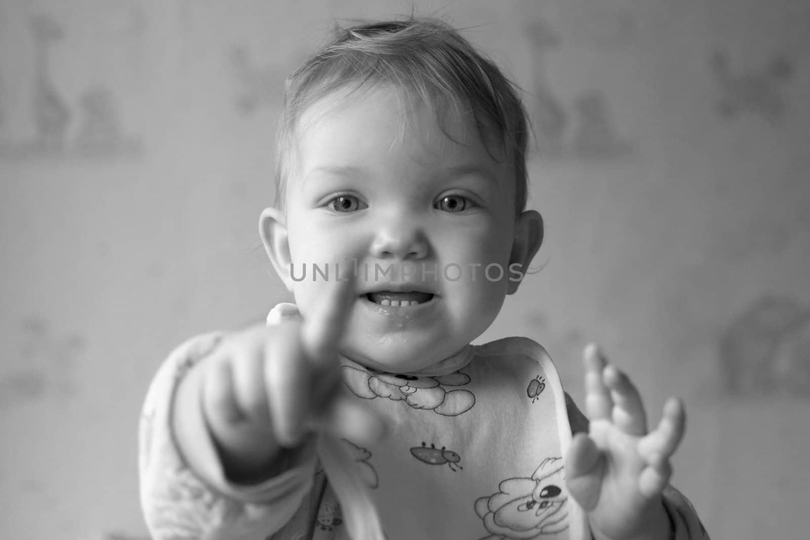 An image of baby in the kitchen.