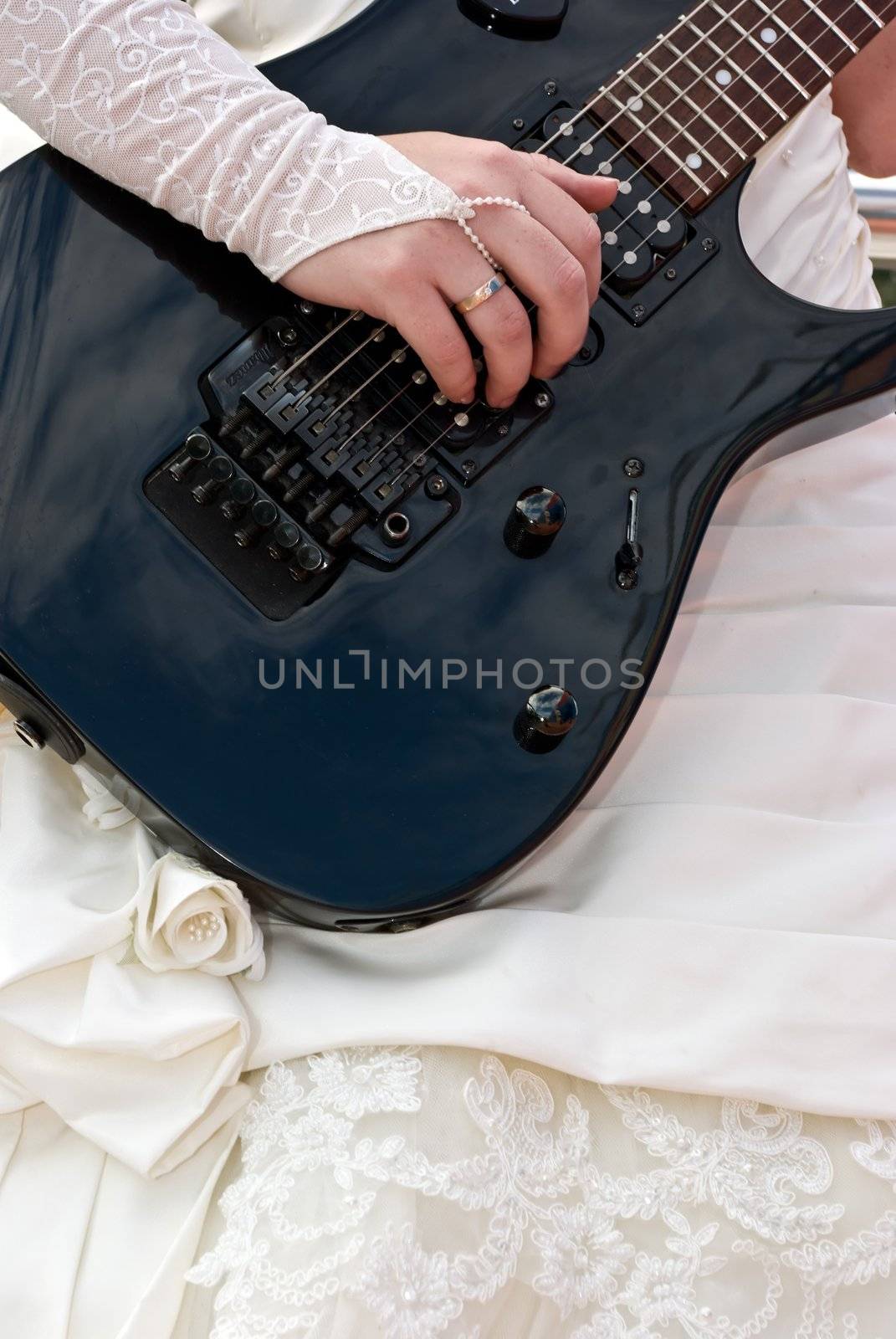 Close up of a female hand with  guitar by H2Oshka