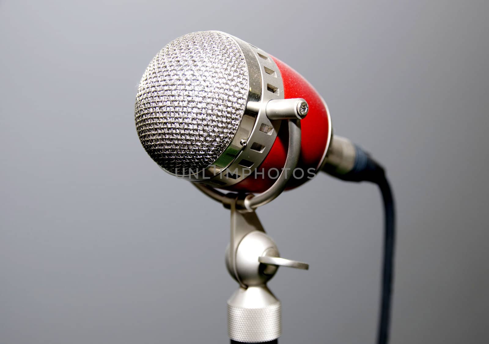 old microphone for singer with a gray background