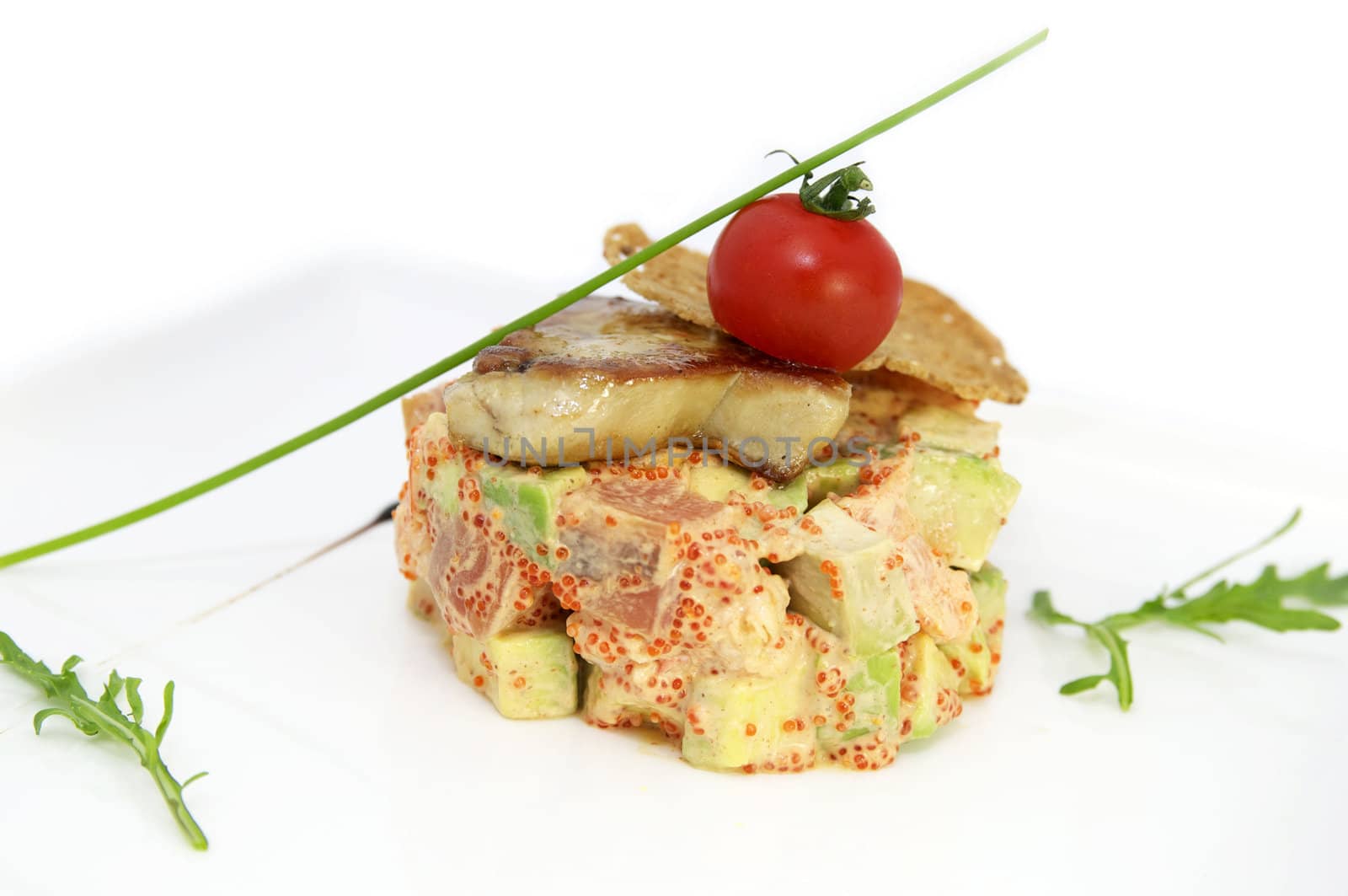 salad, fish and eggs decorated with greens and tomatoes