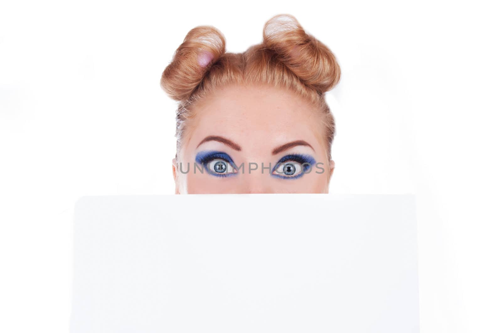 Surprised funny woman peeking over edge of blank paper by Angel_a