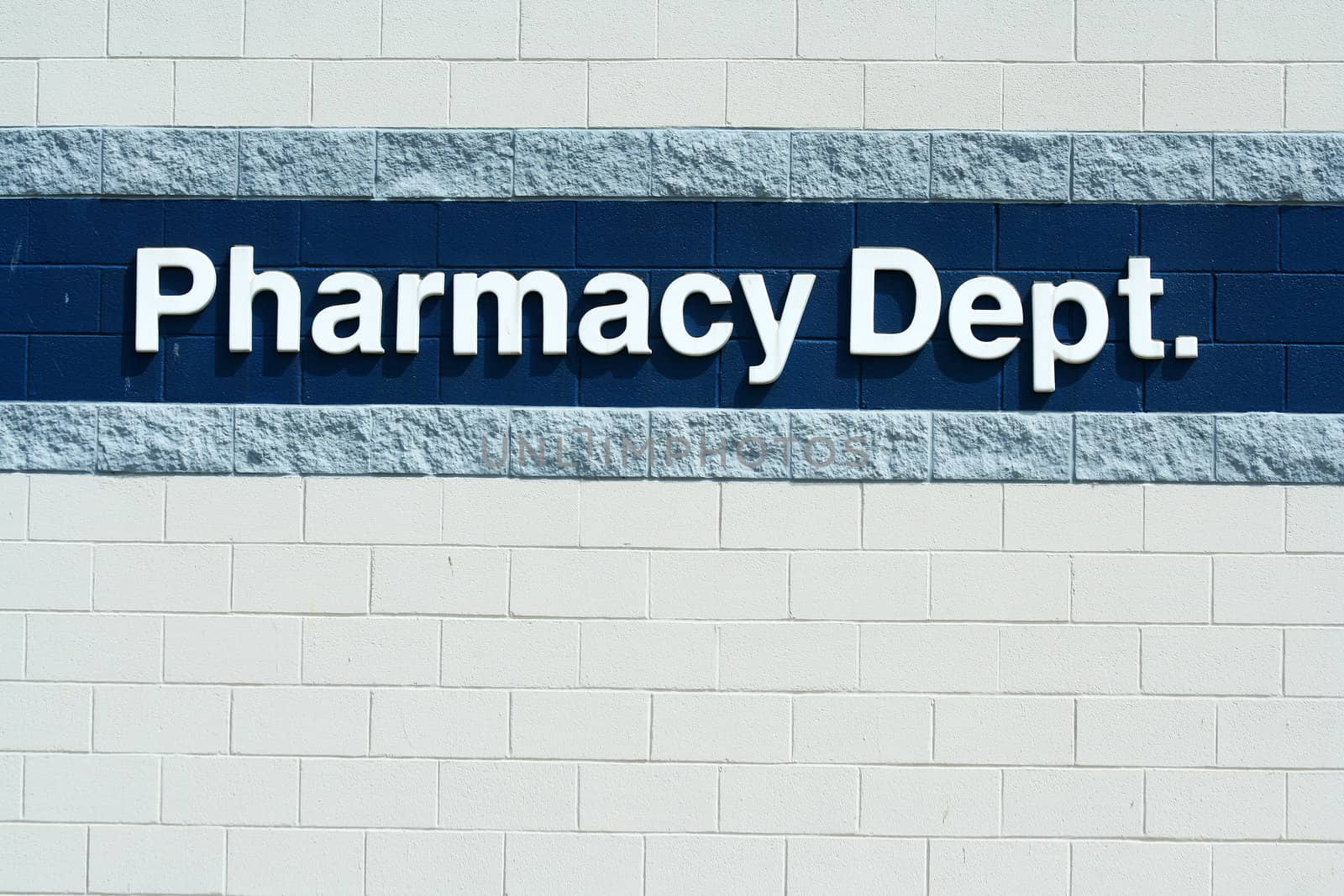 A Pharmacy Dept sign on a wall