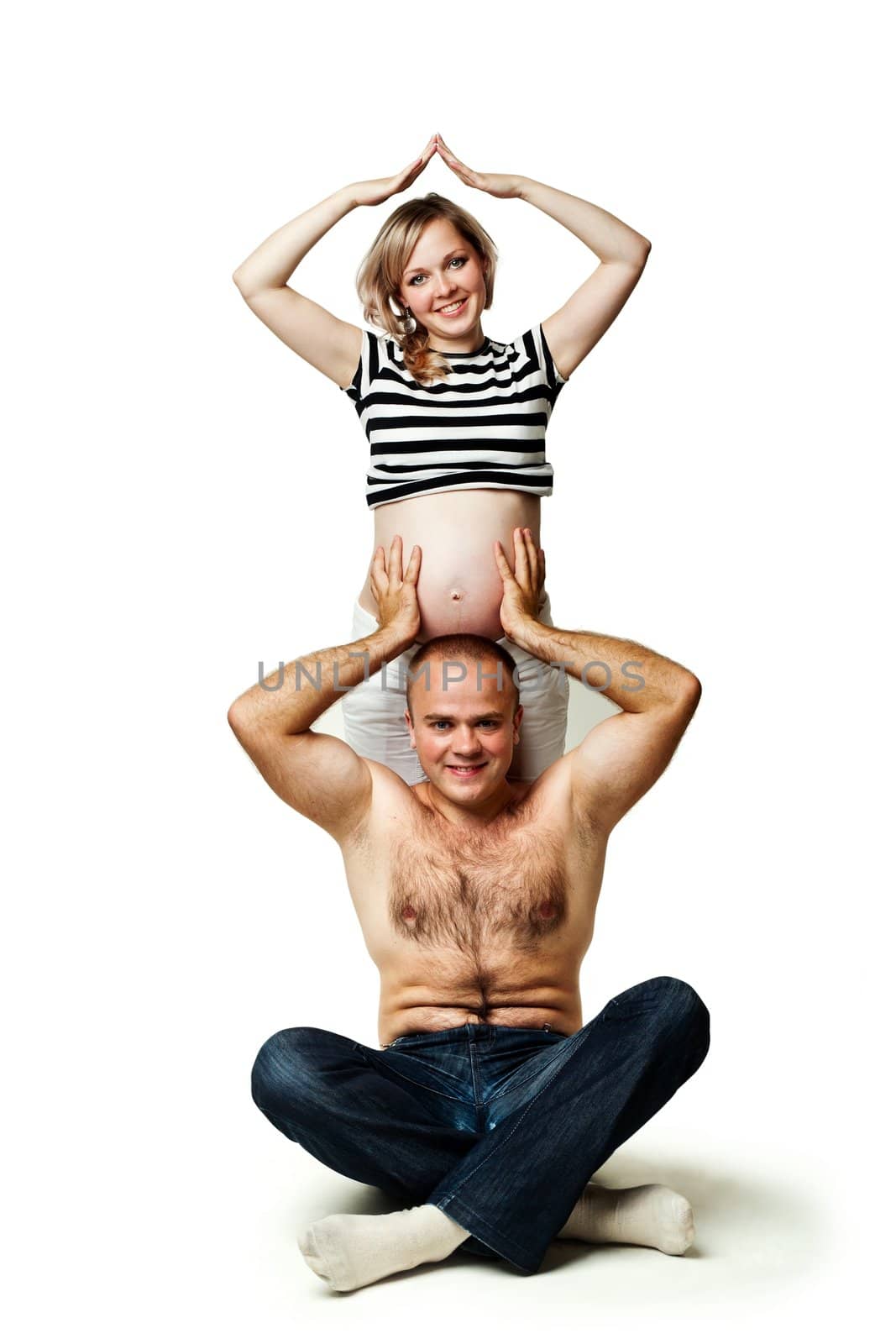 An image of a man supporting his pregnant wife