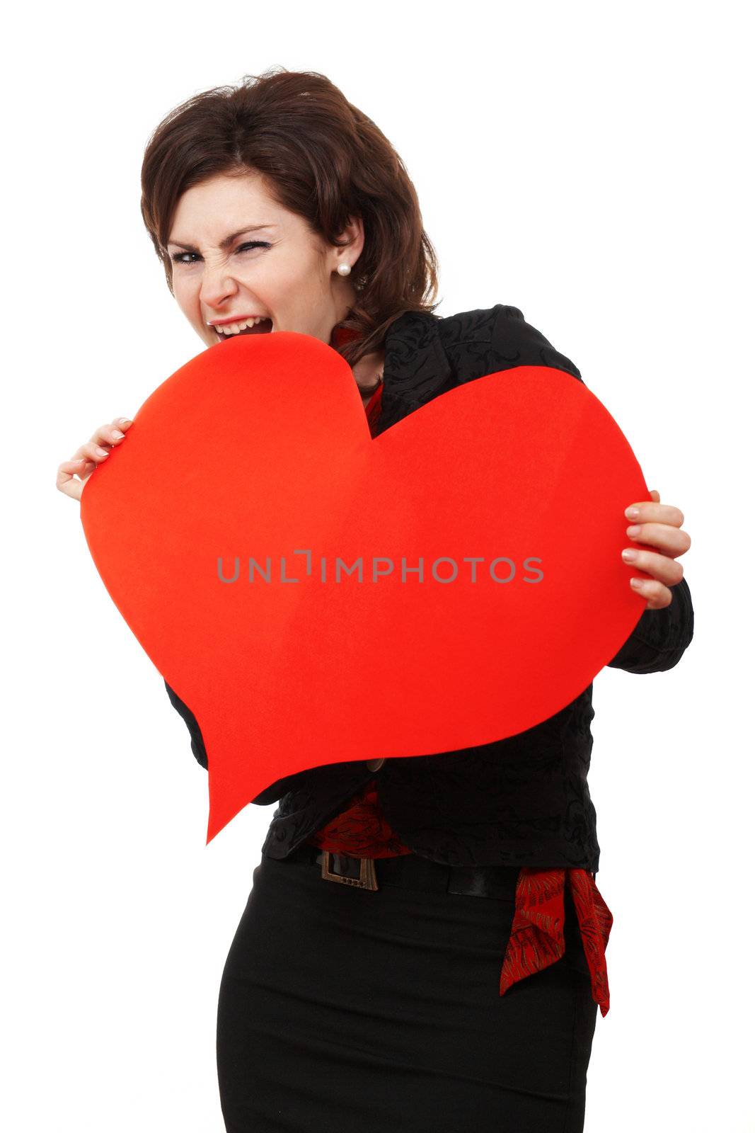 A woman biting a big red heart