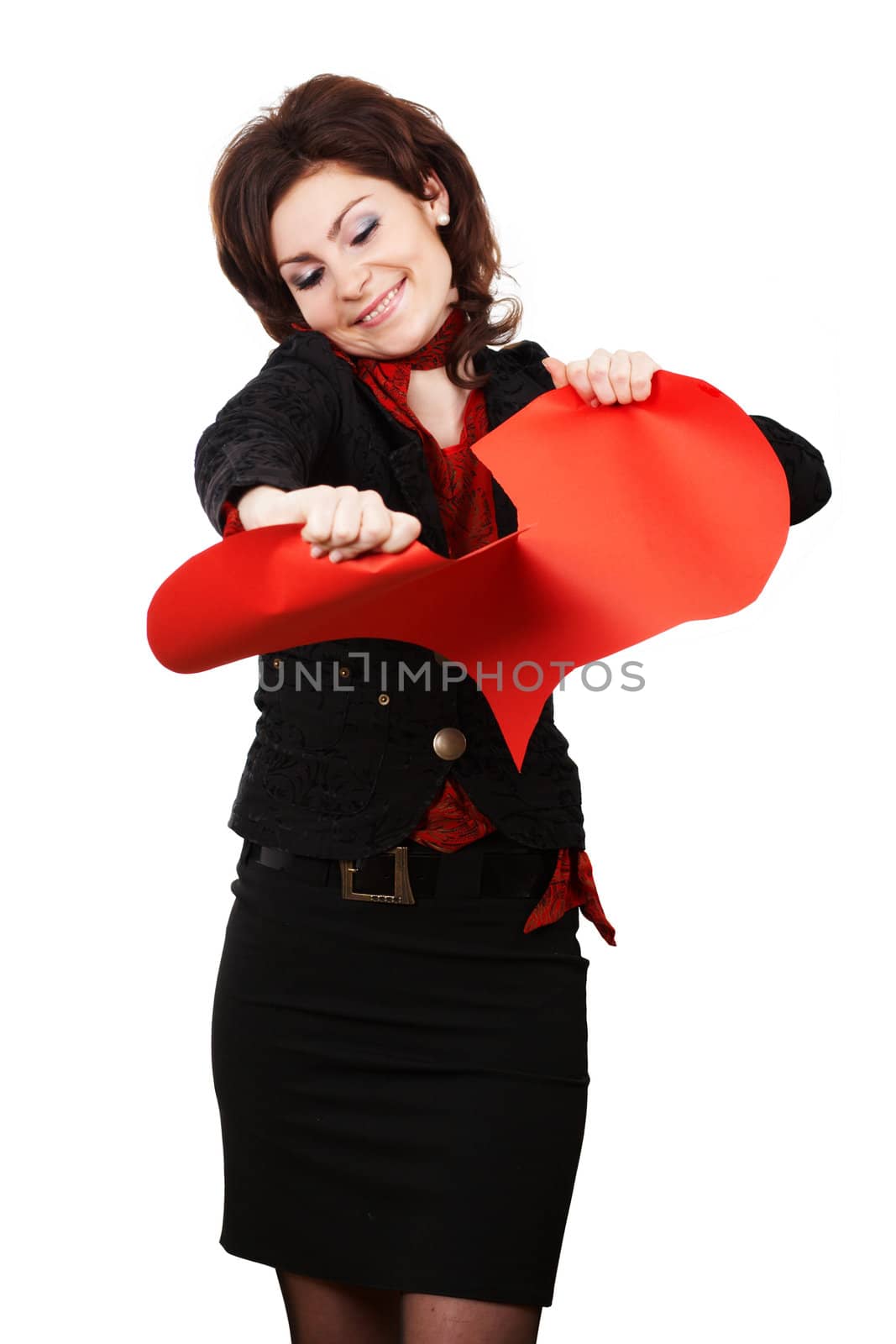 A smiling woman tearing a red peper heart